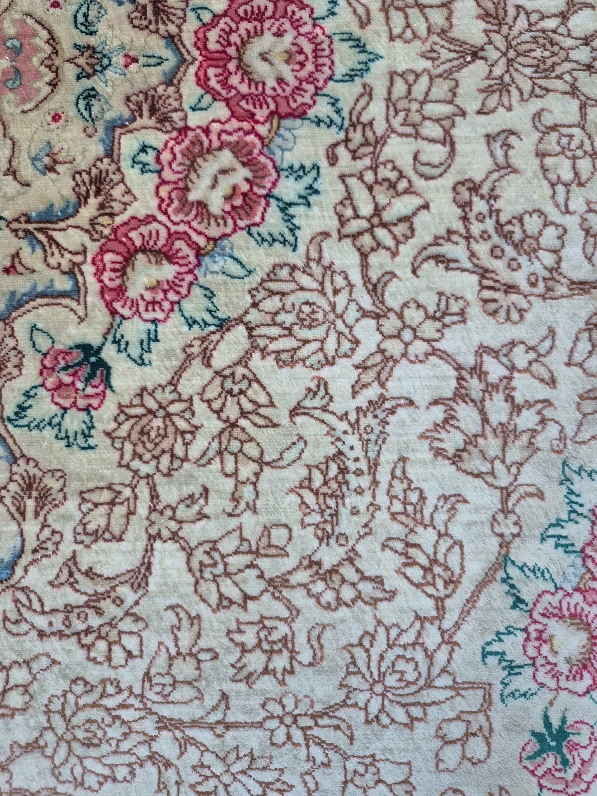 Ivory rug field after pile reweaving